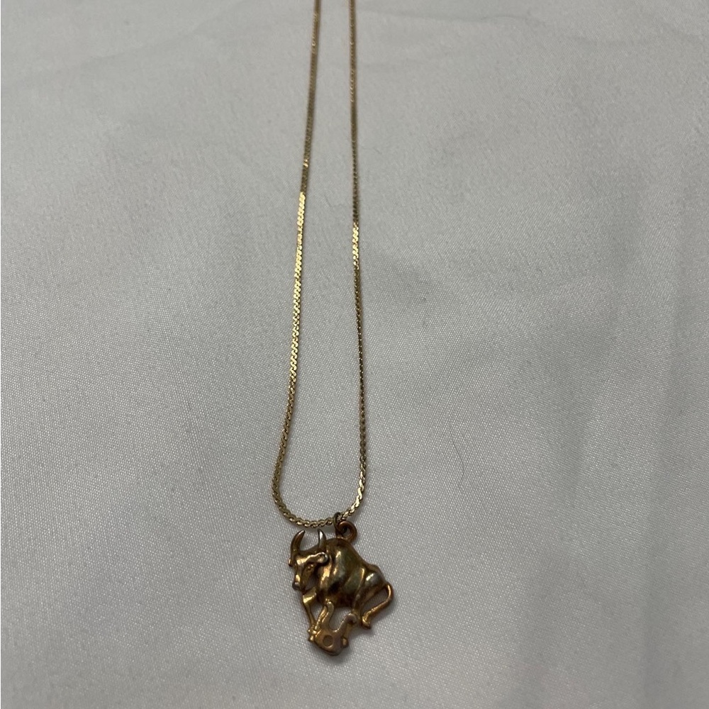 Vintage gold necklace with bull charm- in great condition- brand unknown